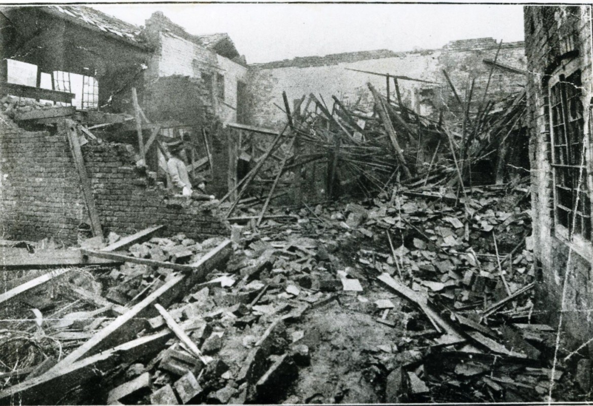 An adult and child looking at the damage in Walsall caused by the zeppelin raid of 1916; thanks to Walsall Local History Centre